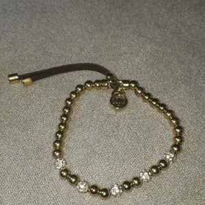 - Michael kors stretchy gold, leather, and p…